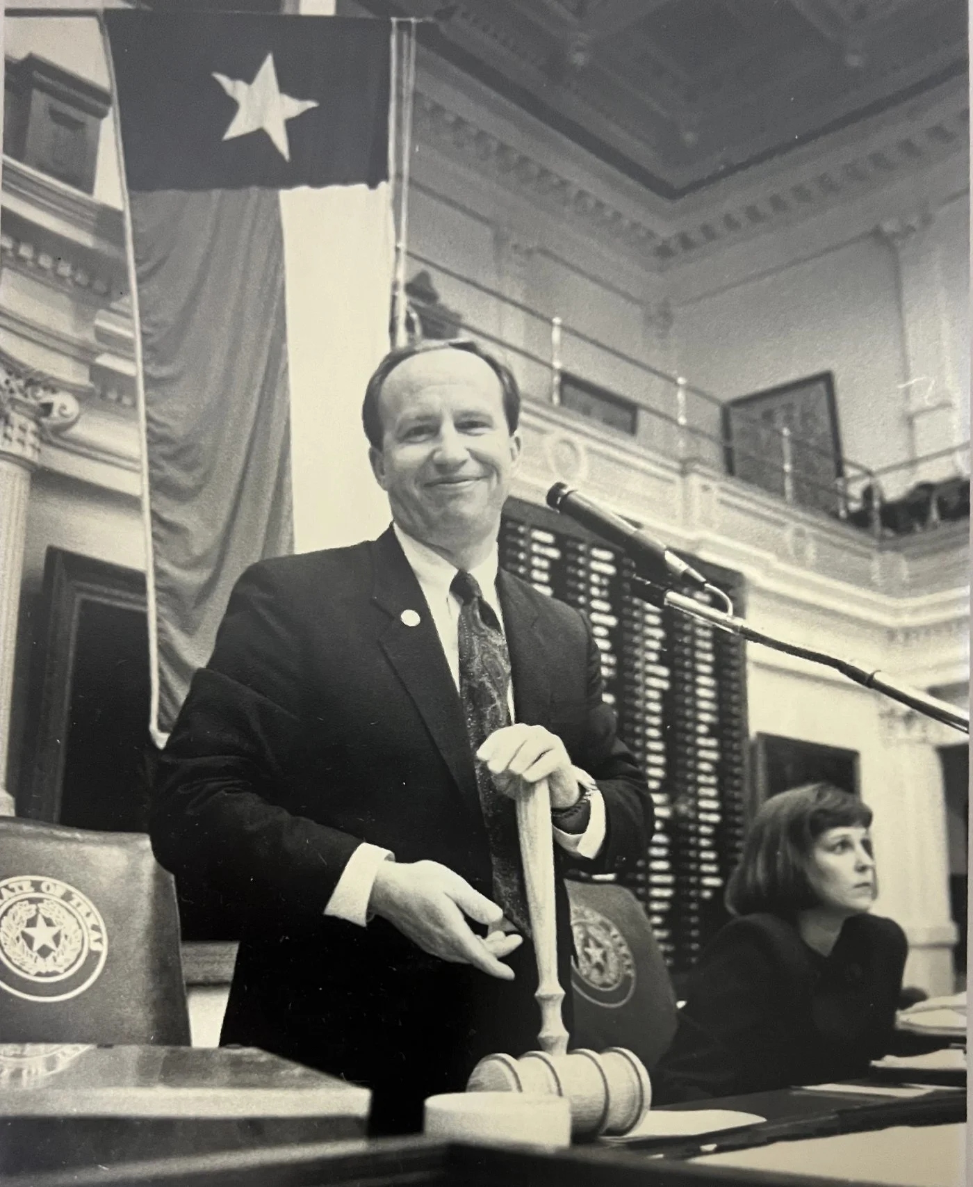 Congressman Brady holding a ceremonial gavel in the chamber of the Texas House of Representatives