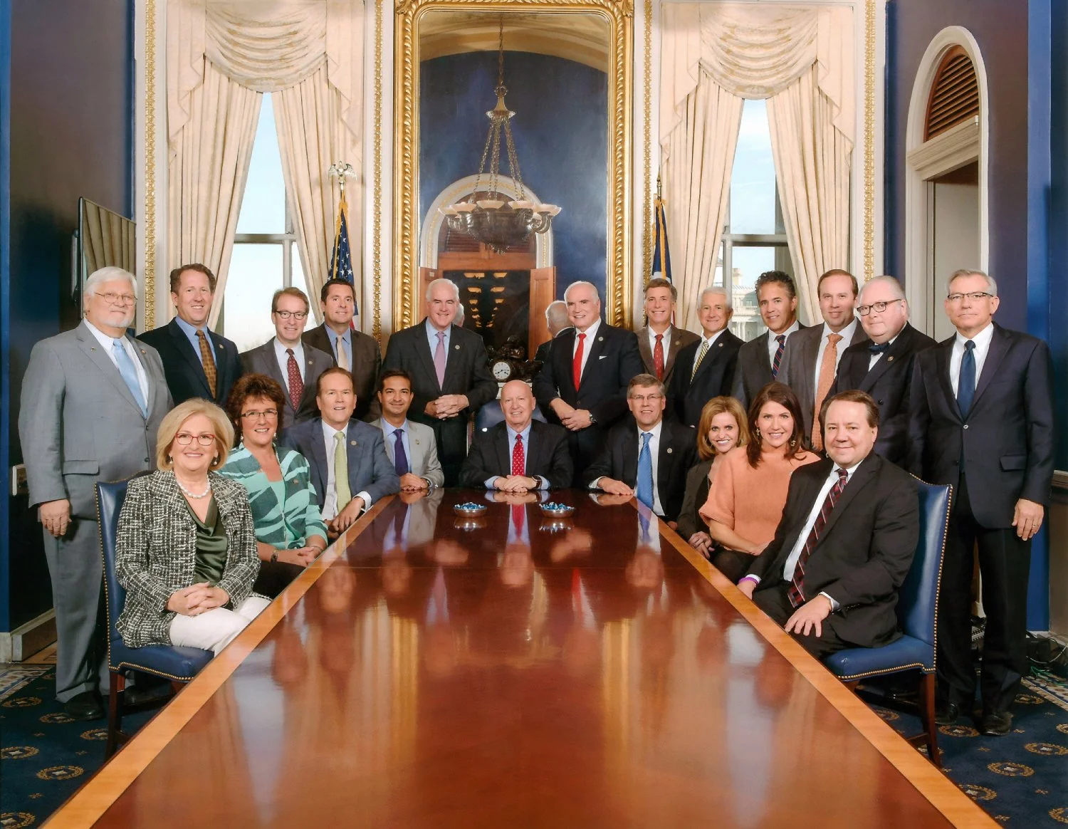 The 24 Republican members of the House Ways and Means Committee under Chairman Brady photographed in a formal committee room in the U.S. Capitol