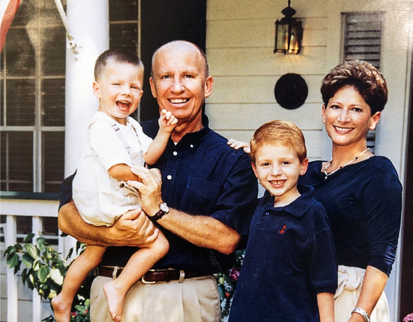 Congressman Brady, his wife, and their sons in front of their home in The Woodlands